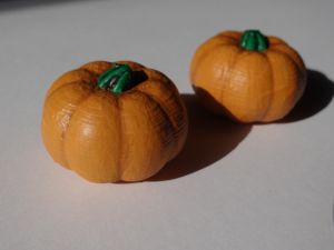a pair of painted pumpkins